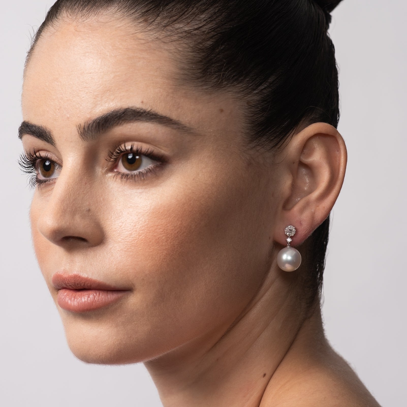 See on model, the Autore Amore Earring featuring white diamonds and Australian South Sea Pearl on 18kt white gold