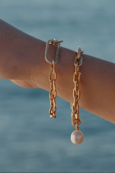 Autore South Sea Pearl on 18kt gold link bracelets on model