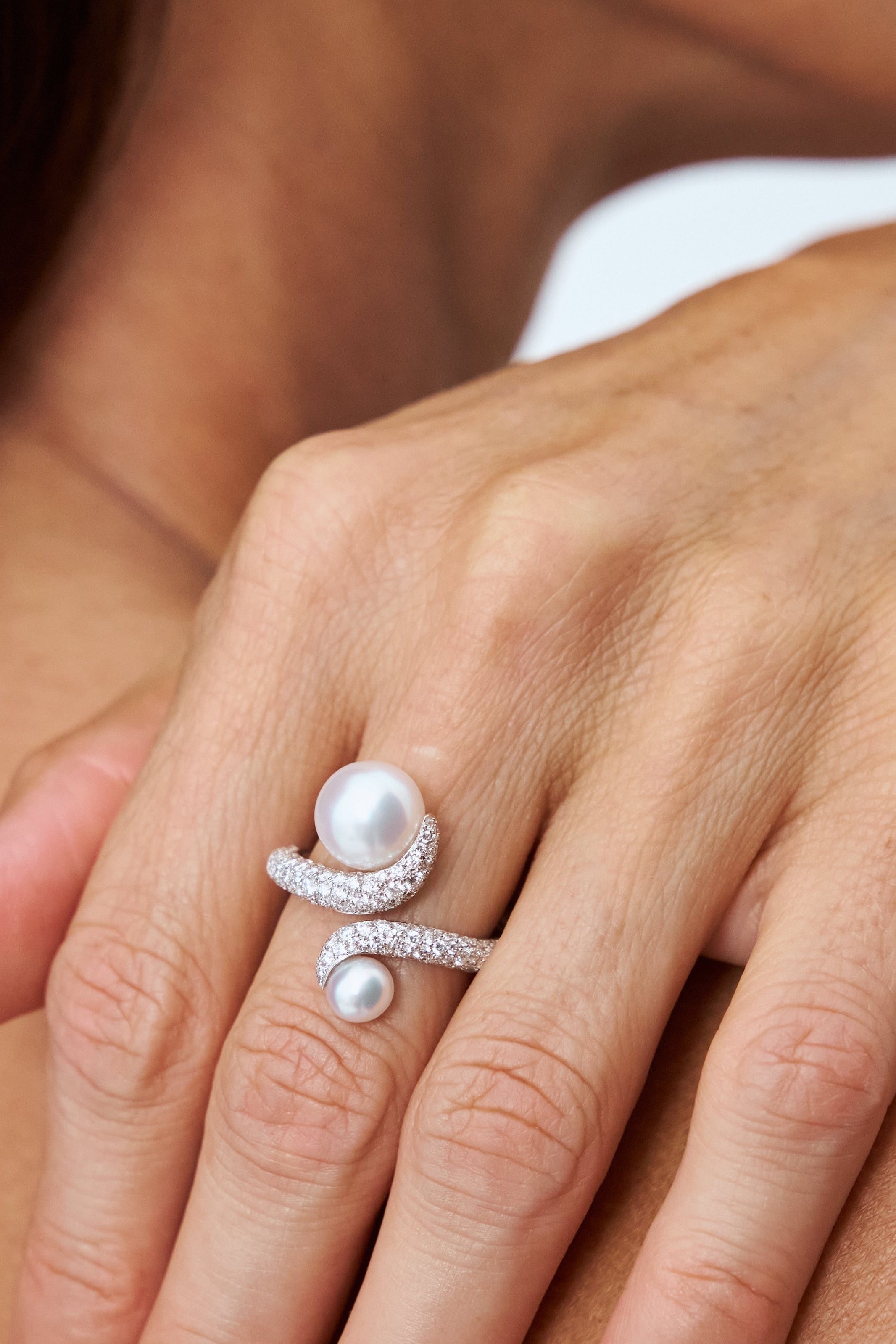 Model close-up of south sea pearl toi and moi ring in 18kt white gold