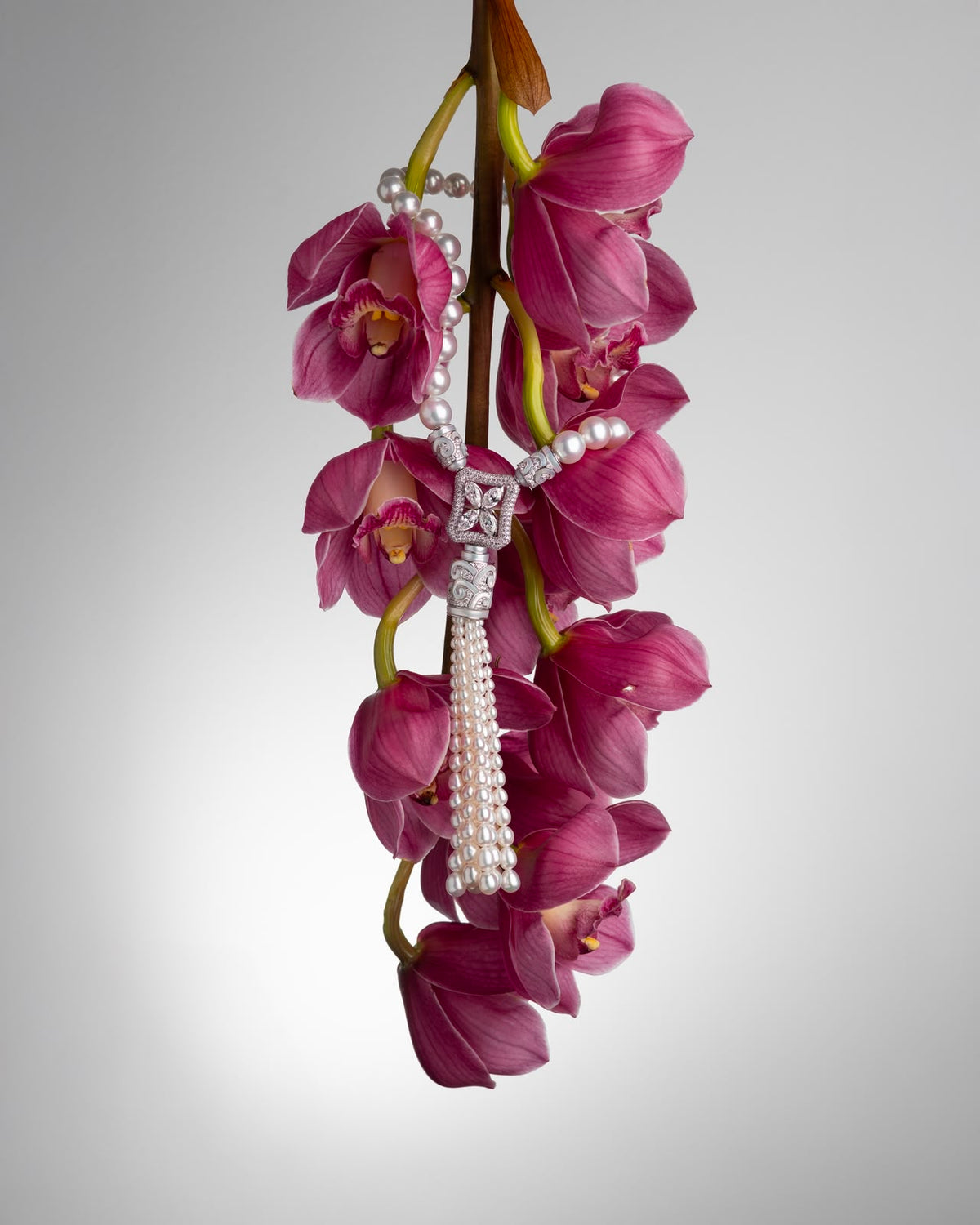 AUTORE Art Deco Tassel Necklace with South Sea pearls draped over pink orchids