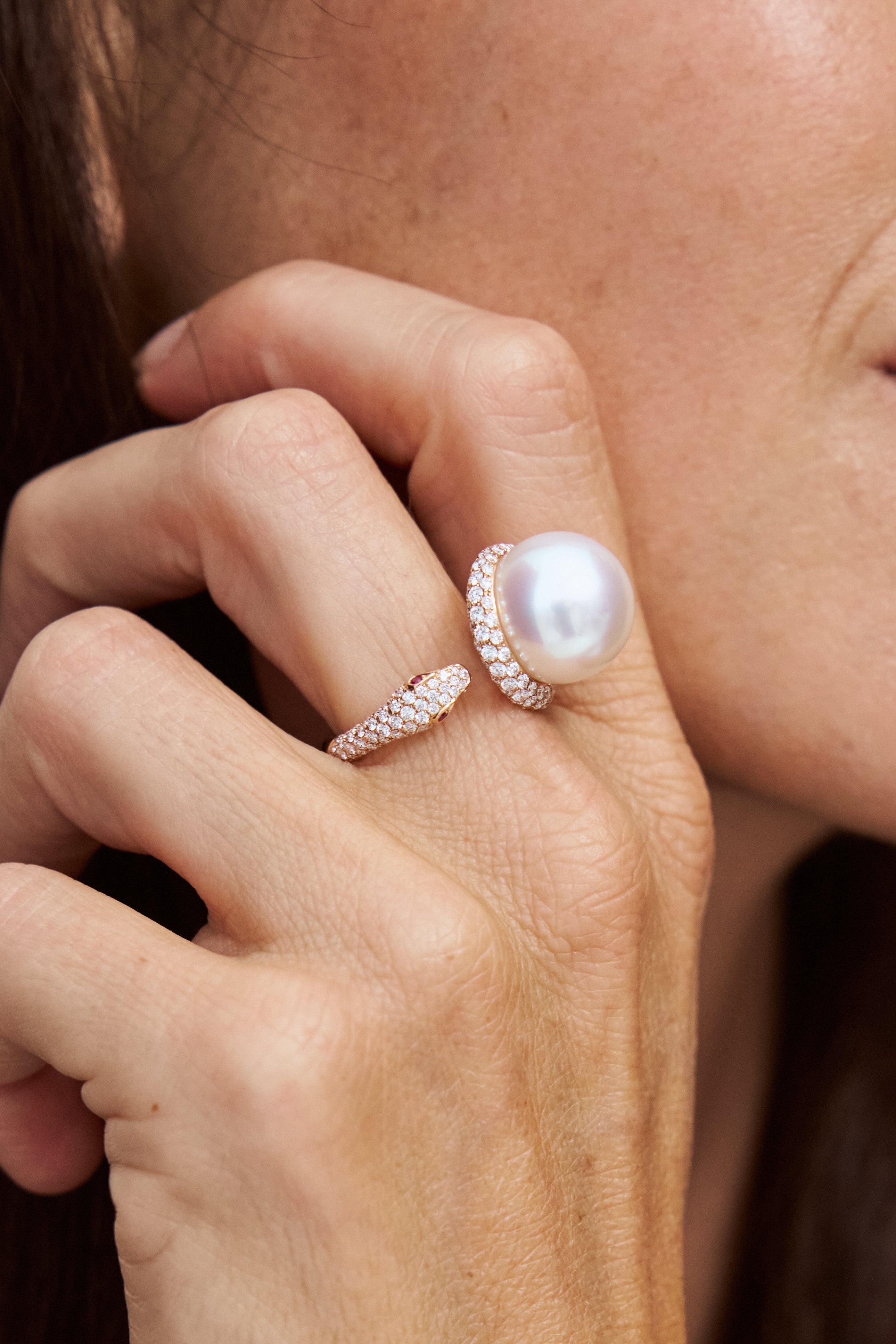 Autore South Sea Pearl set in 18kt rose gold with white diamond and ruby eyes ring.