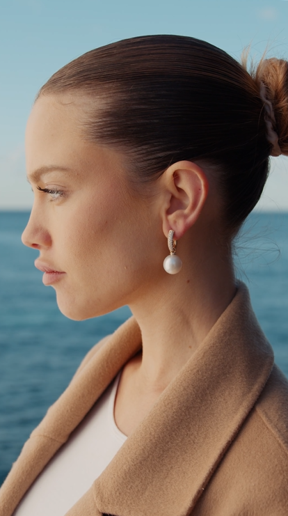 Autore South Sea Pearl on 18kt yellow gold diamond pave earring on model