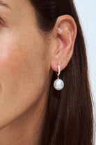 Close-up image of Autore South Sea Pearl Serenity Pave Tapered Huggies