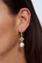 Model wearing Autore South Sea pearl orchid drop earrings in 18kt rose gold with pink diamonds

