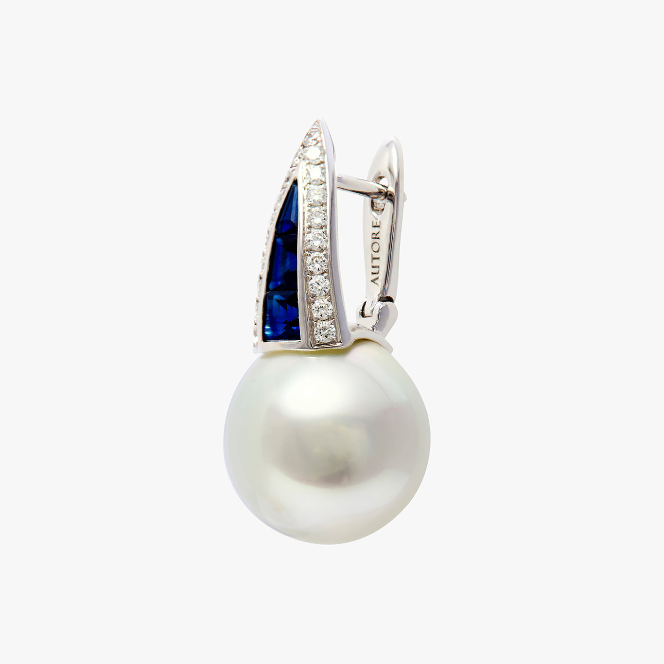 Autore Deco Huggie earring featuring blue sapphires, white diamonds and Australian South Sea Pearls on an 18kt white gold hoop