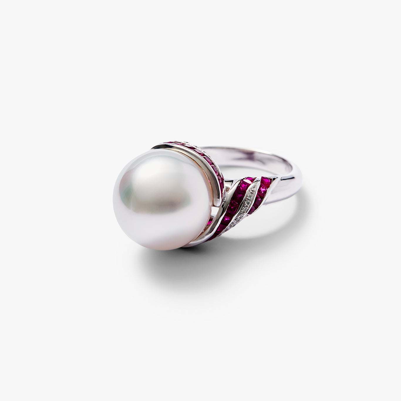 Close-up detail of the Autore South Sea pearl ring in 18kt white gold with ruby and white diamond accents