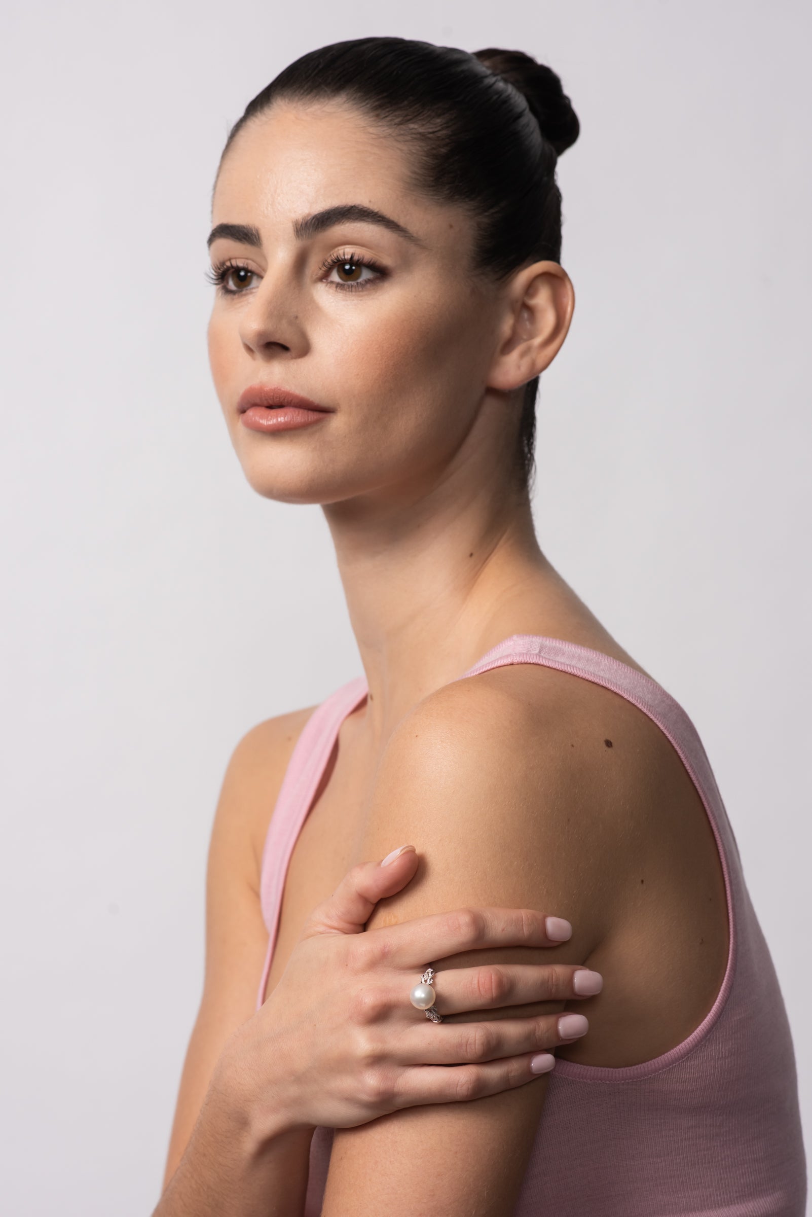 Autore Hercules Knot Ring featuring an Australian South Sea Pearl with white diamonds on model