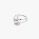 An Autore 18kt white gold plain eternity band featuring a white South Sea Pearl 